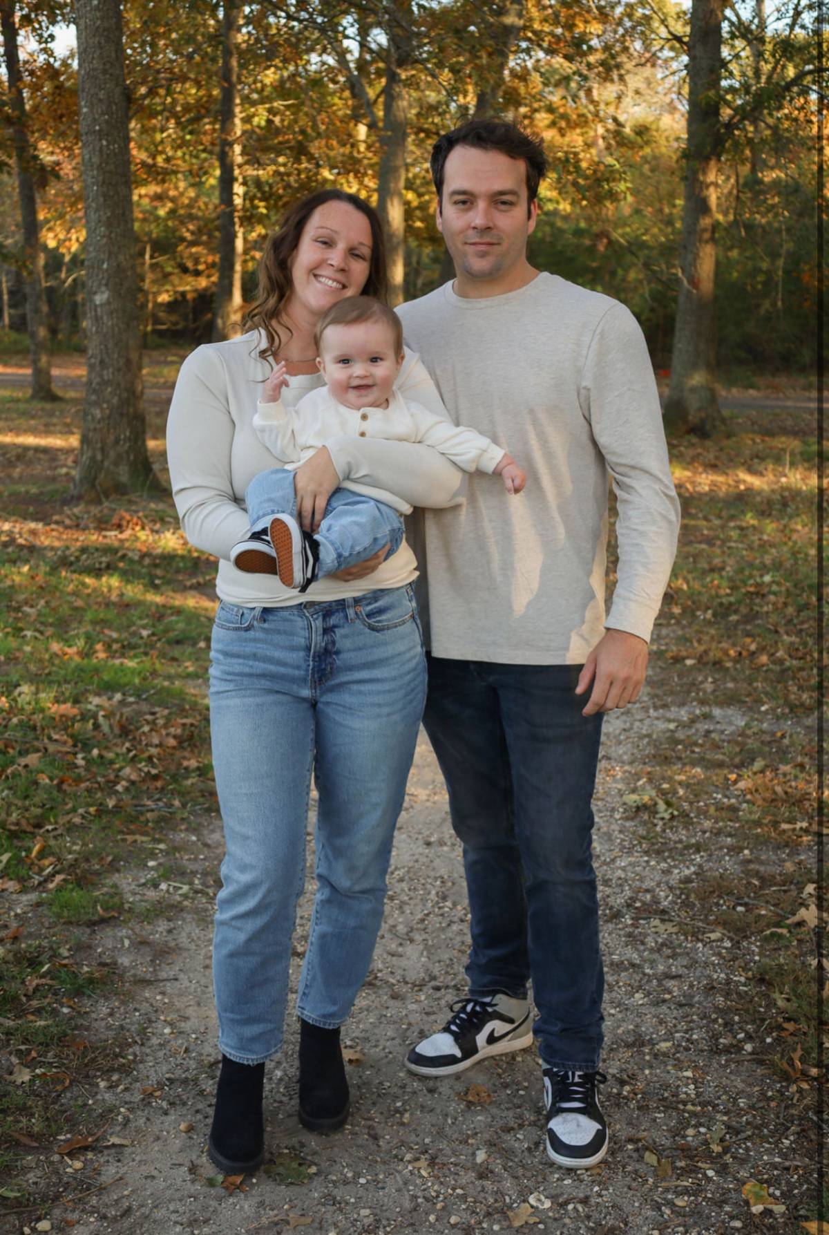 Dan Beerley with his family outdoors in autumn.