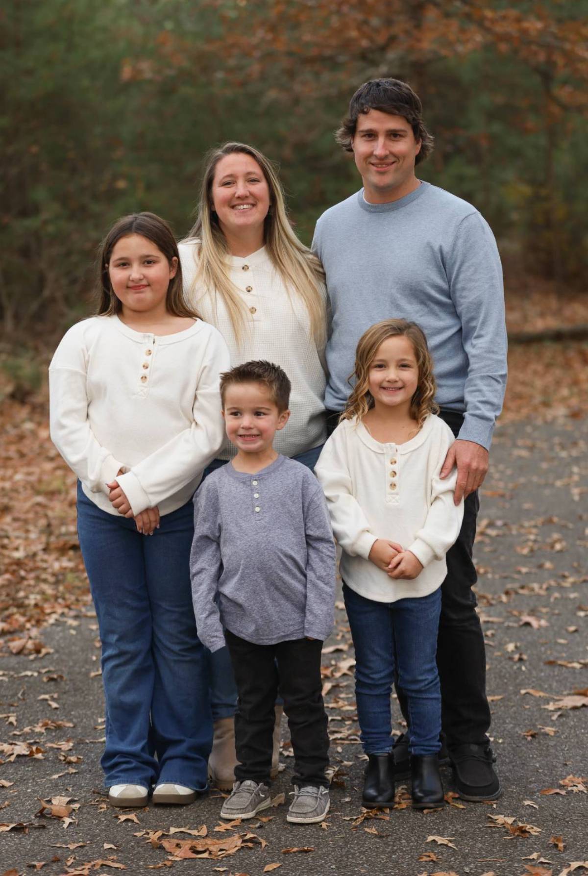 Paul Beerley with his family outdoors in autumn.